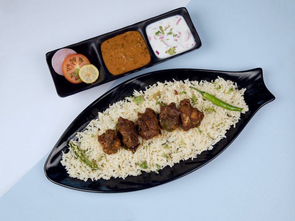 delicious-lamb-biryani-with-raita-and-curry-35267287